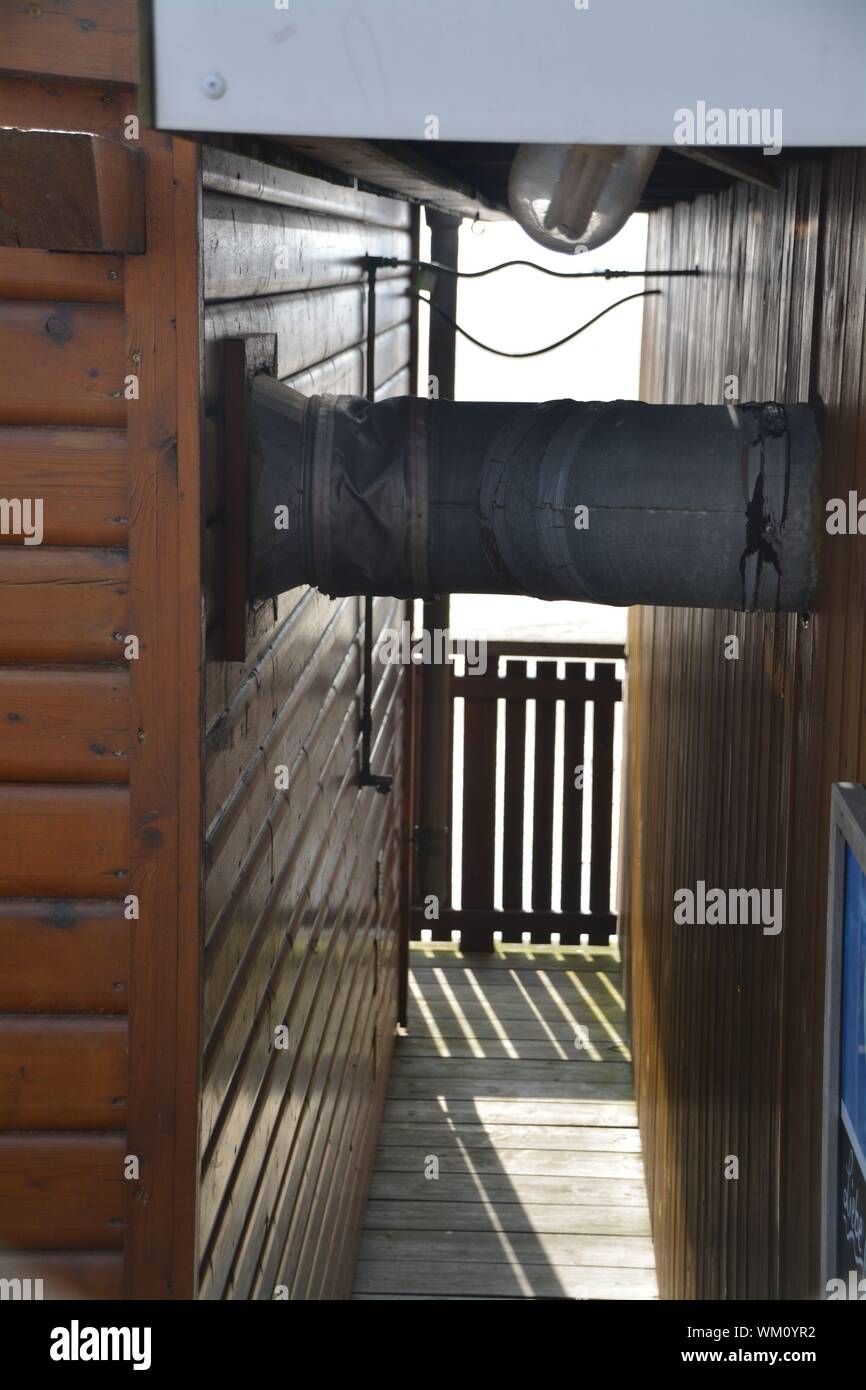 Metallic Pipe Amidst Log Cabins Stock Photo 270470454 Alamy