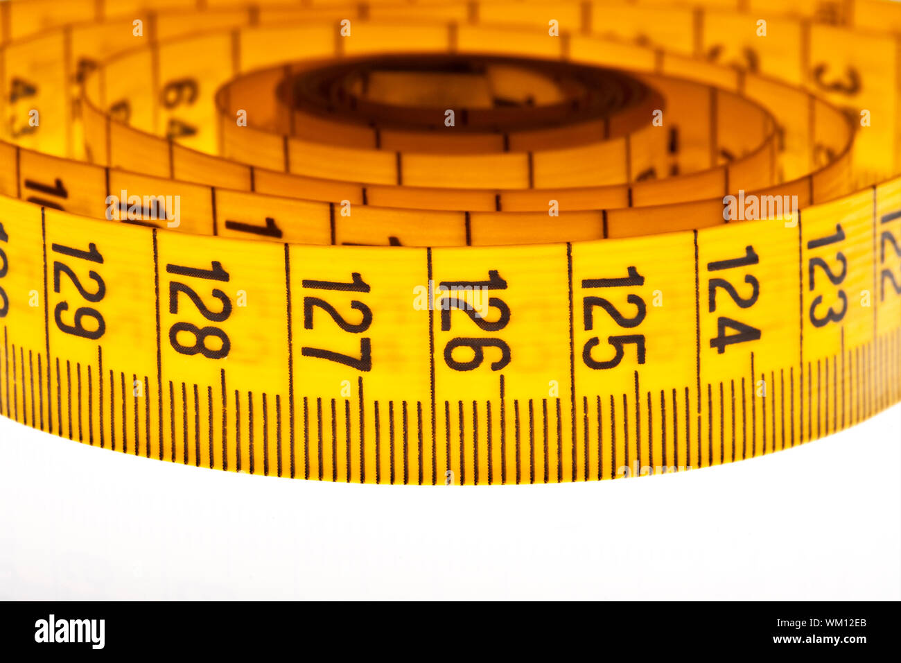 diet - yellow measuring tape isolated on white background Stock Photo ...