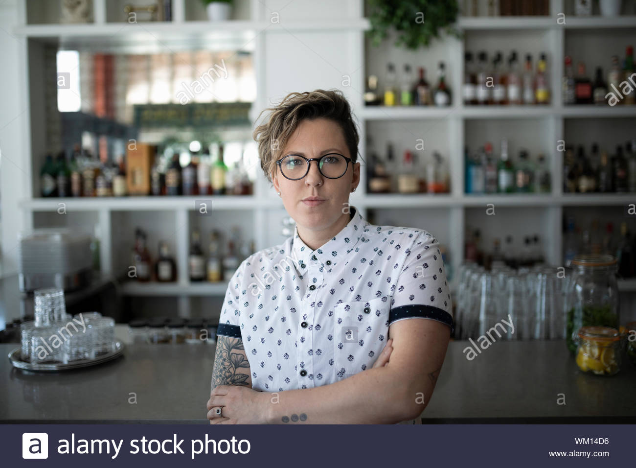 Portrait of small business owner in cafe looking at camera Stock Photo