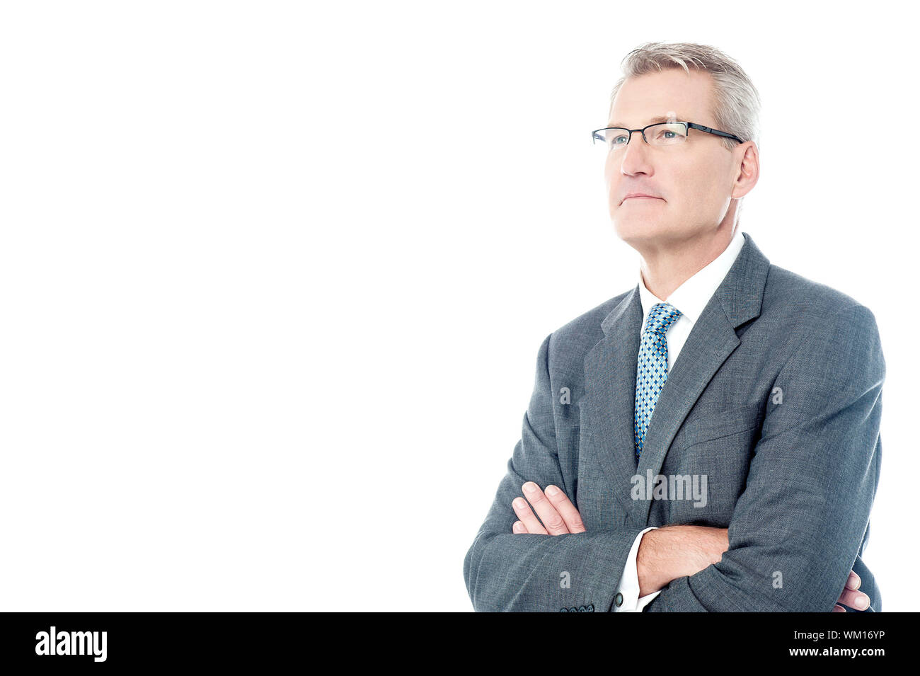 Mature businessman posing with crossed arms Stock Photo - Alamy