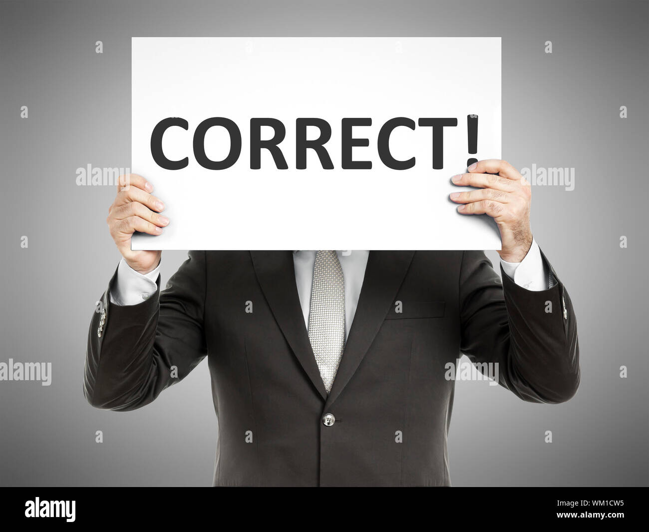 Paper Correct A business man holding a paper in front of his face with the text ...