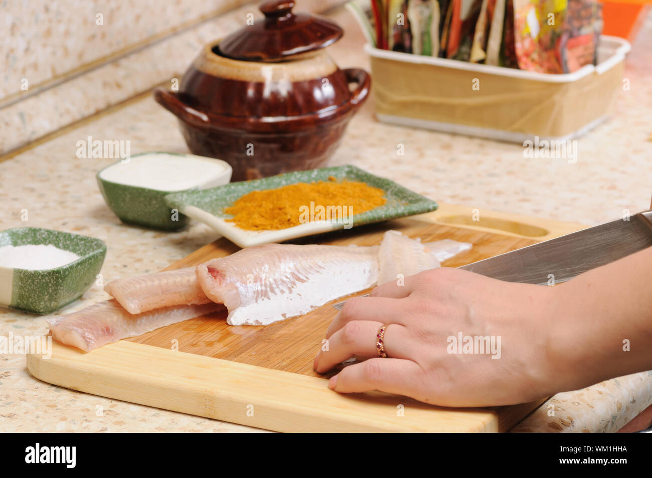 Meal preparation on kitchen from a fish Stock Photo - Alamy