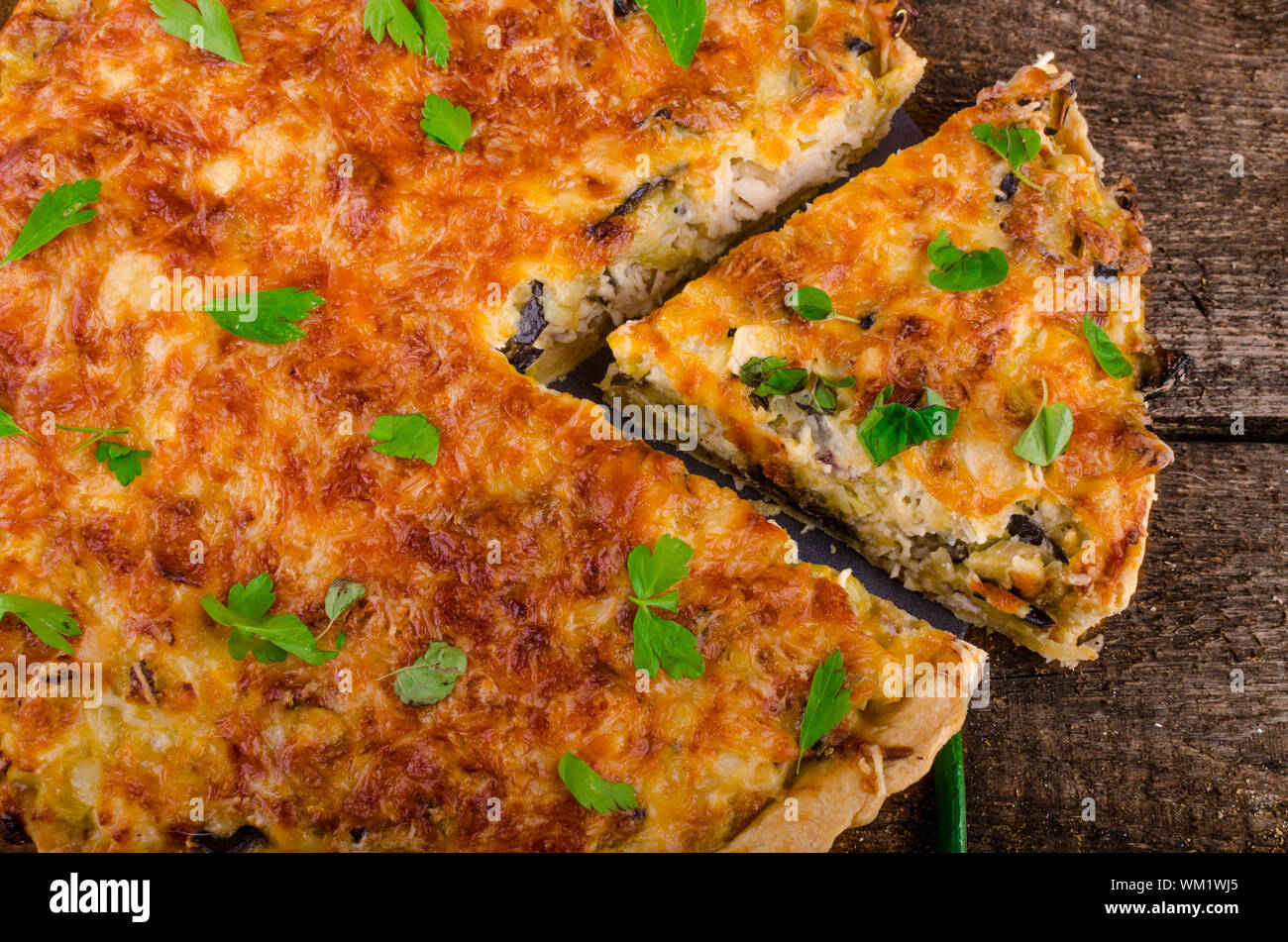French Quiche with eggplant, leeks and spring onions, bathed in a