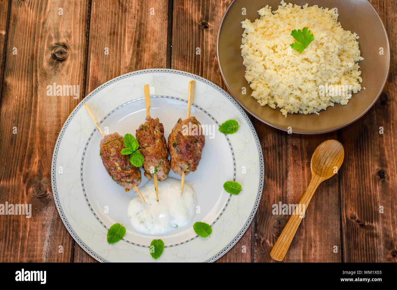 Beef kebab with coriander, garlic, couscous and mint dip Stock Photo