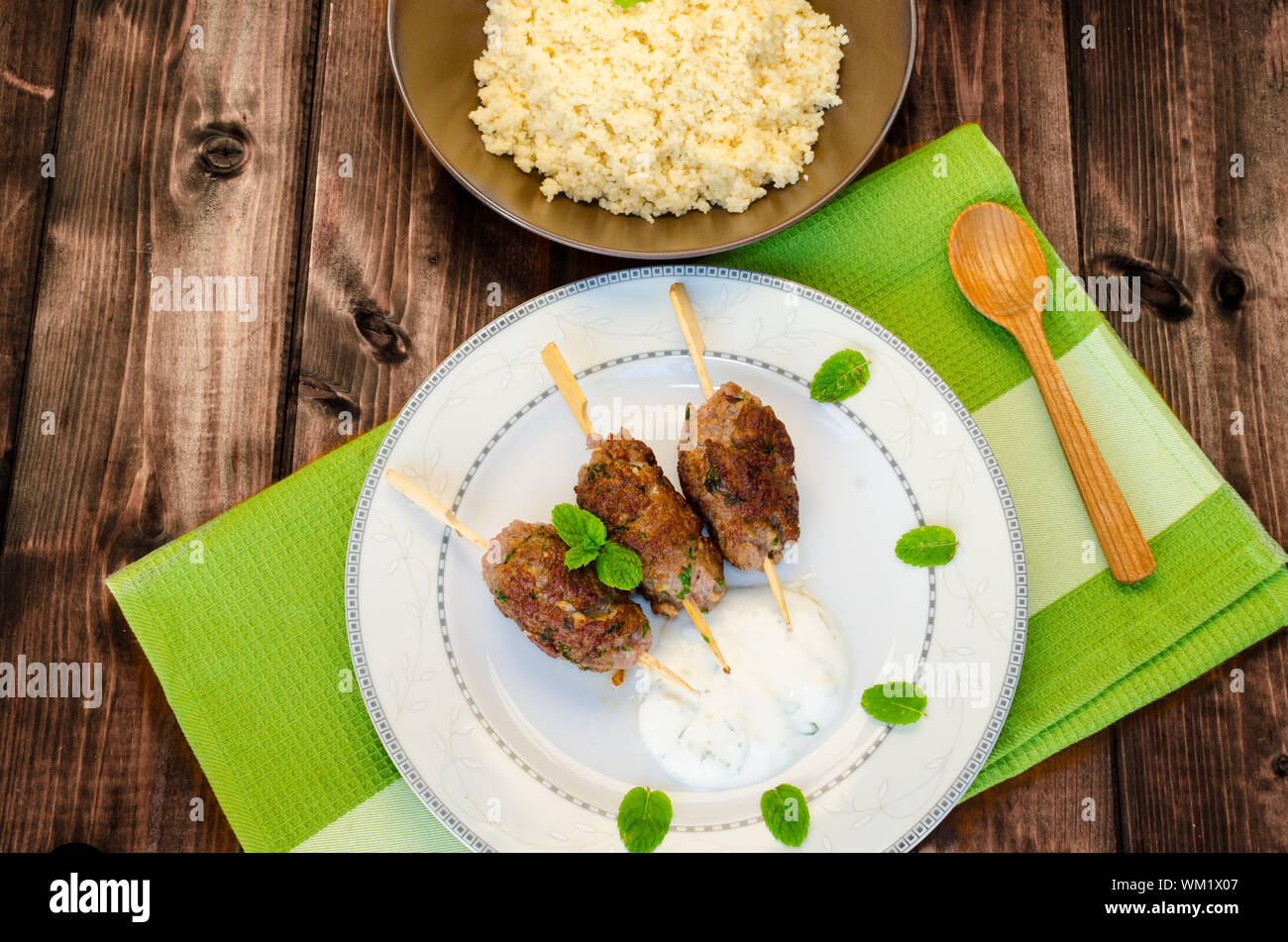 Beef kebab with coriander, garlic, couscous and mint dip Stock Photo