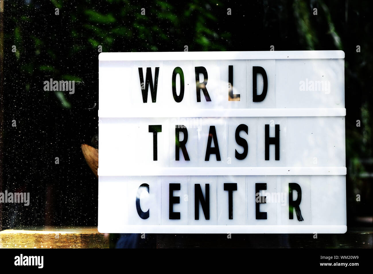 Ecology concept. World trash center writing on vintage style lightbox in a store window. Zero Waste. Stock Photo