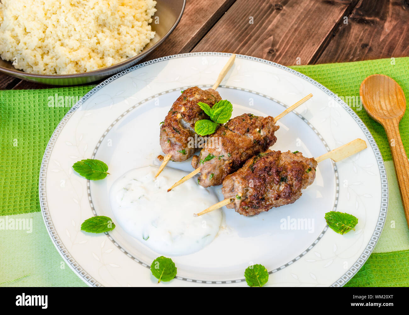 Beef kebab with coriander, garlic, couscous and mint dip Stock Photo
