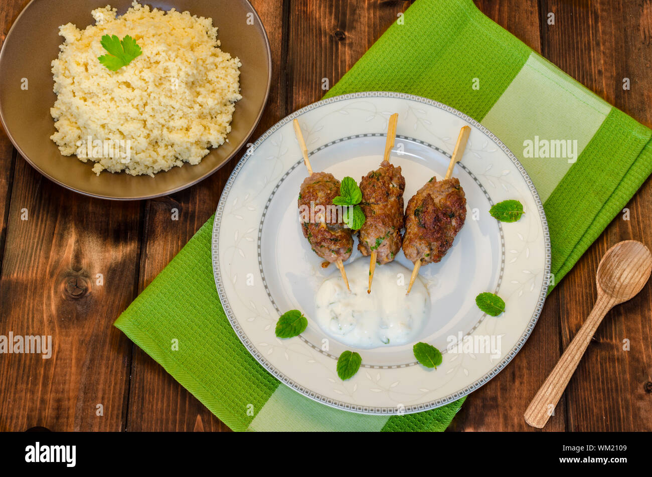 Beef kebab with coriander, garlic, couscous and mint dip Stock Photo Alamy
