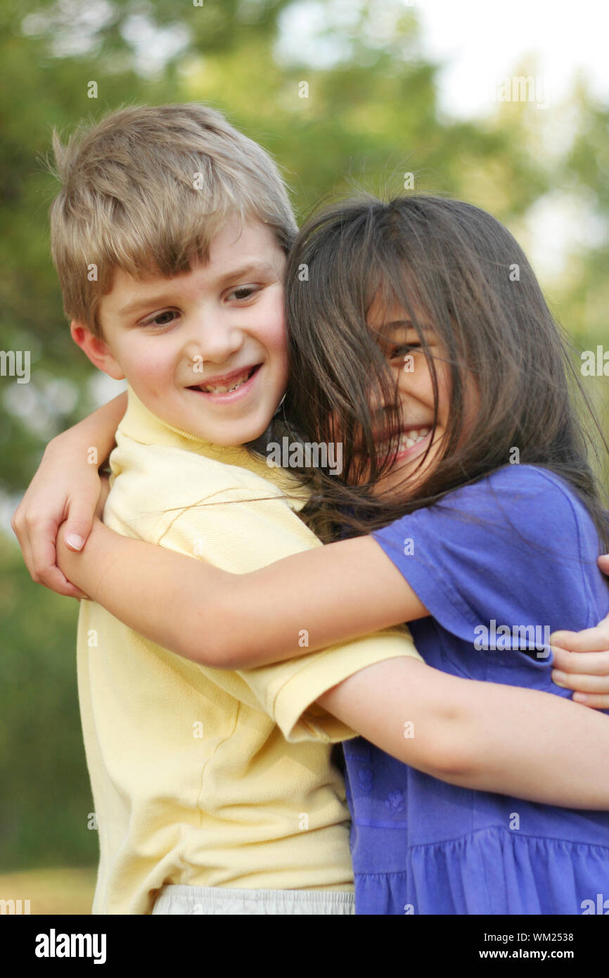 Best friends hugging, multicultural friendships Stock Photo