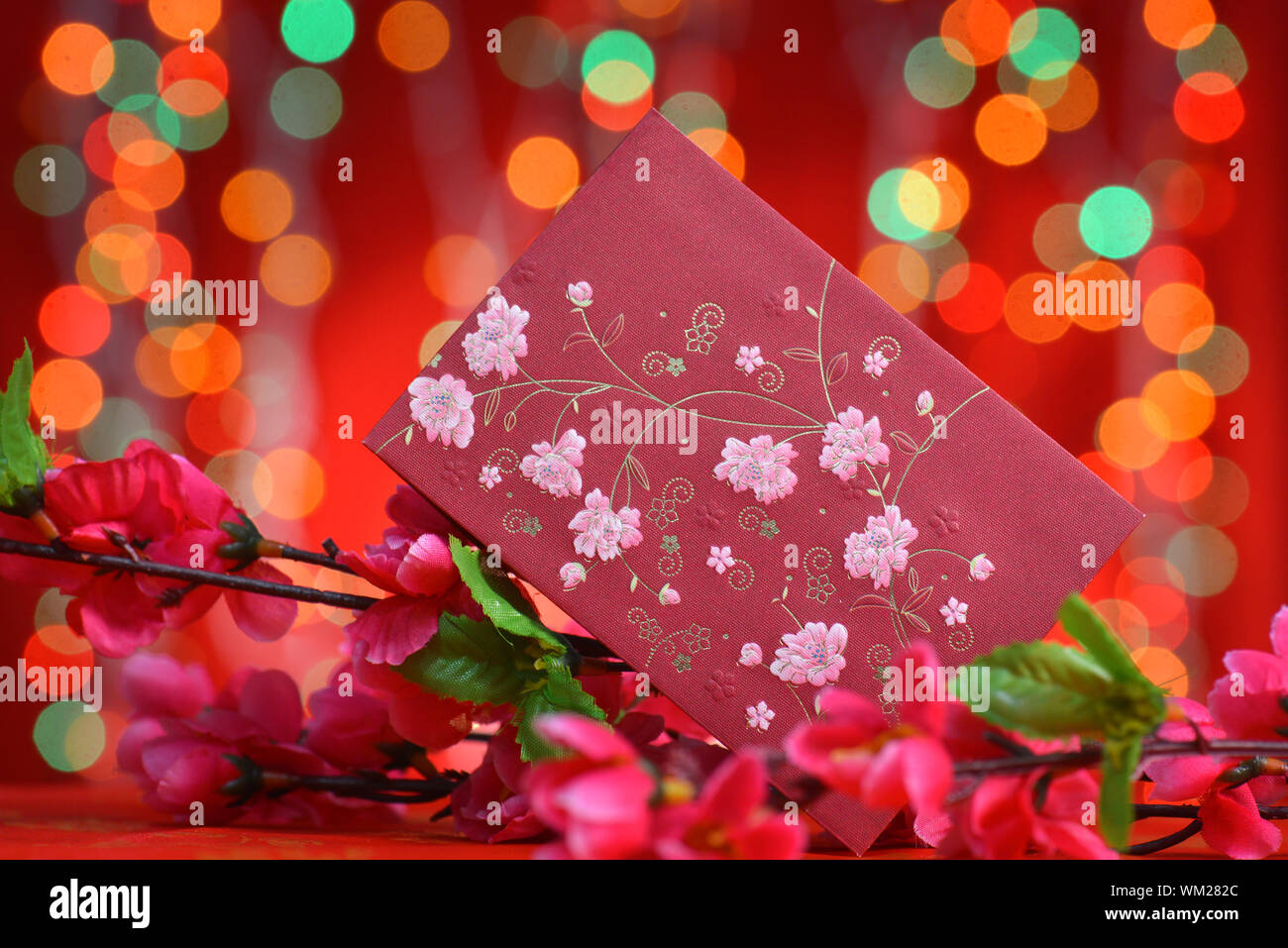 Chinese new year festival decorations, ang pow or red packet and plum