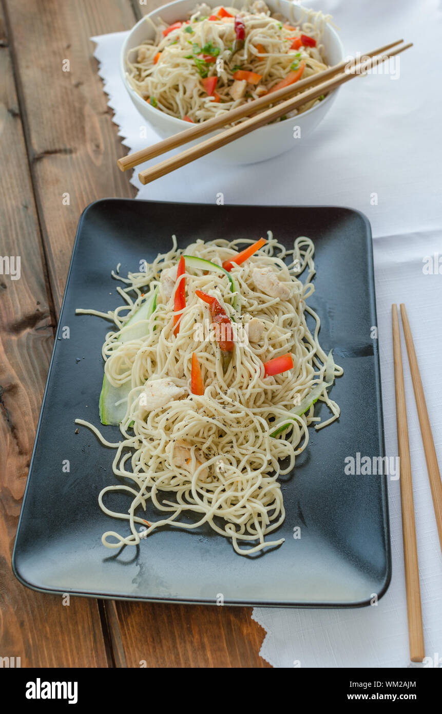 Chinese noodles, fast but delicious food with chopsticks Stock Photo