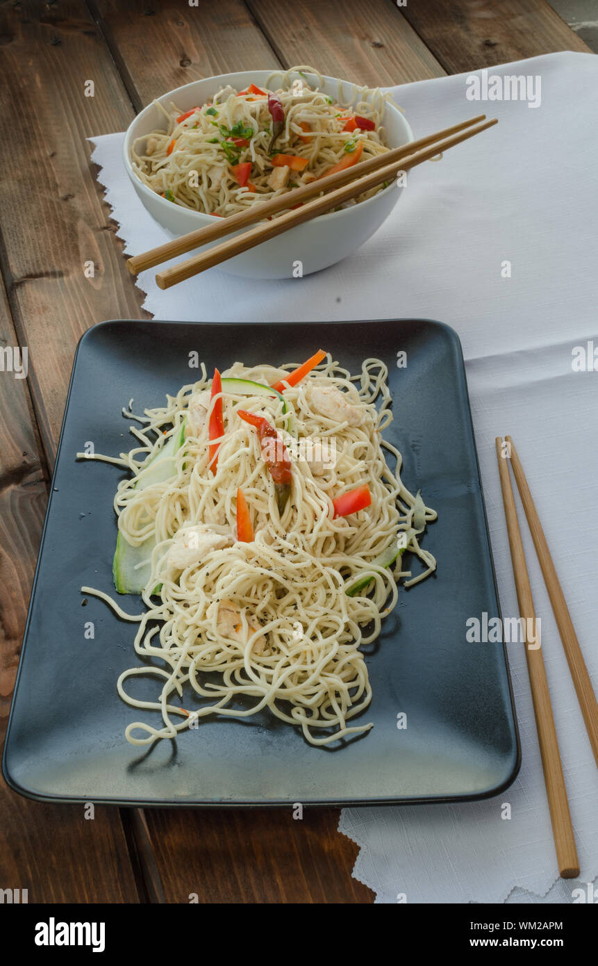 Chinese noodles, fast but delicious food with chopsticks Stock Photo