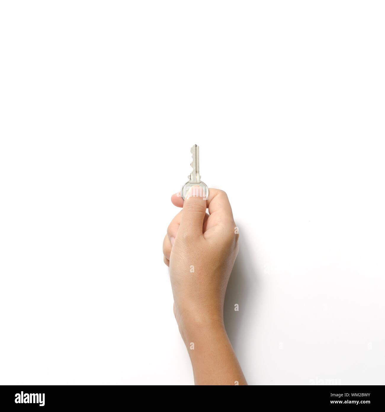 woman hand holding key on a white background Stock Photo - Alamy