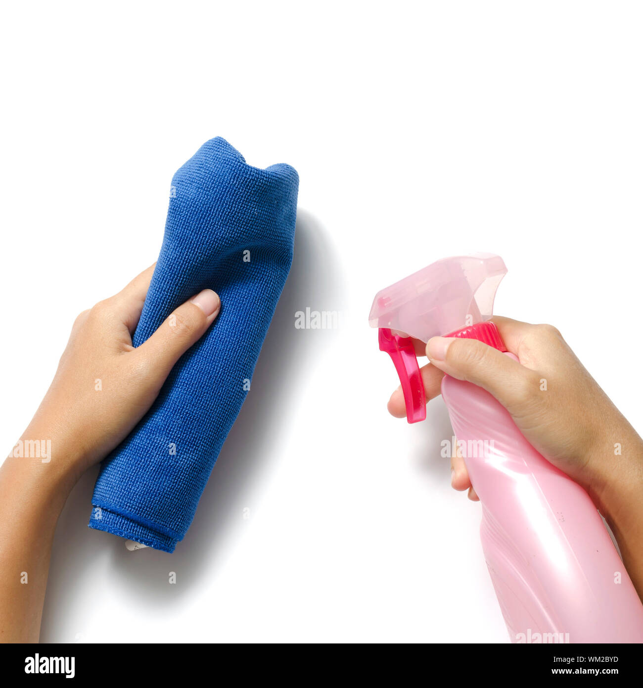 hand cleaning with spray bottle and blue rag Stock Photo