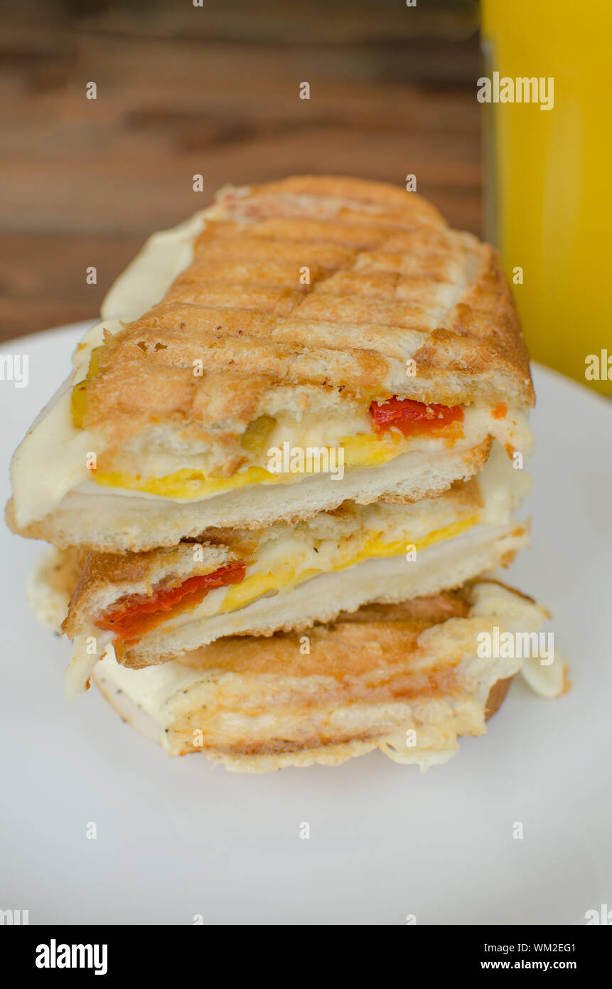 Panini sandwiches italien with paprica, cheese, eggs and ham Stock