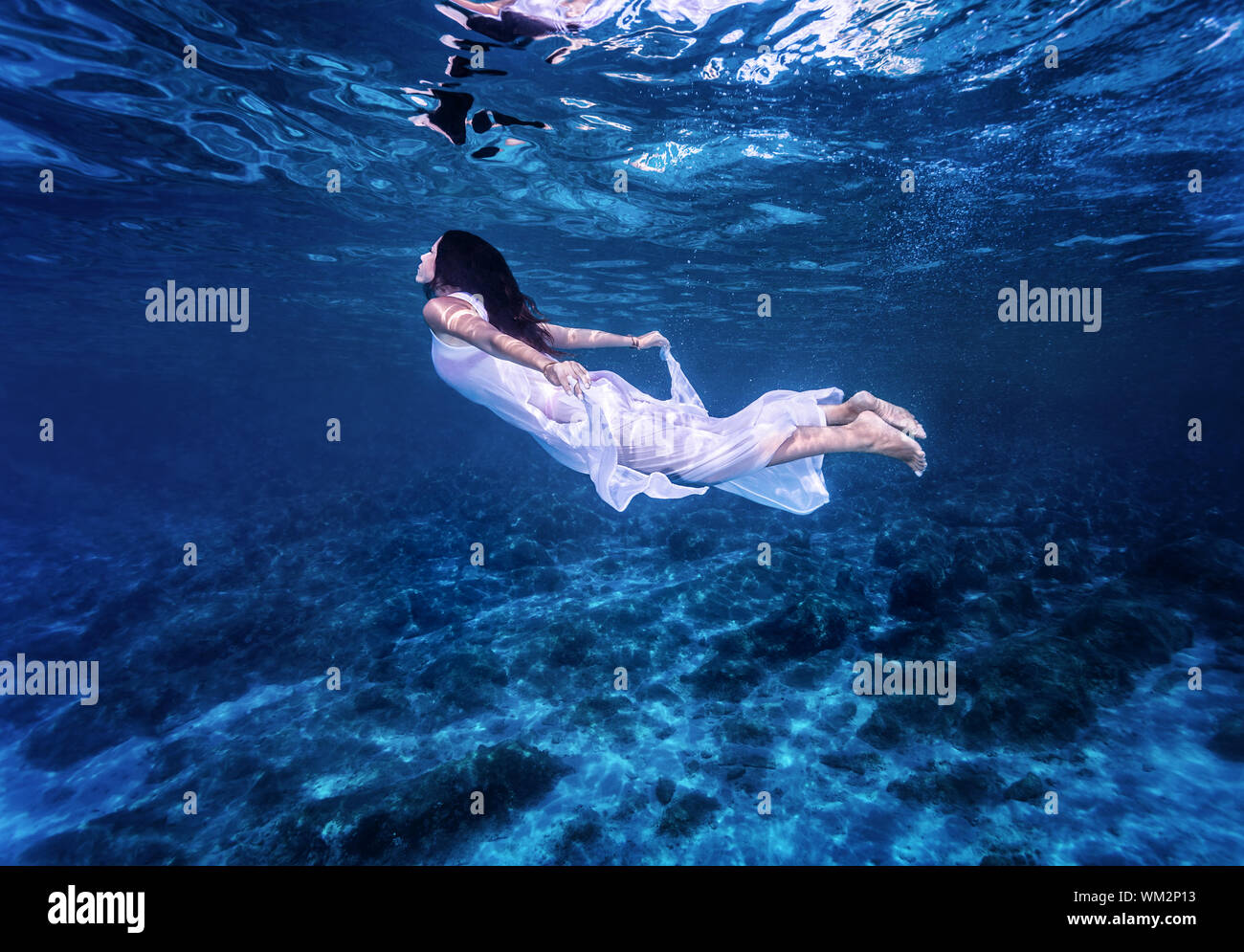 Swimming in beautiful blue sea Stock Photo
