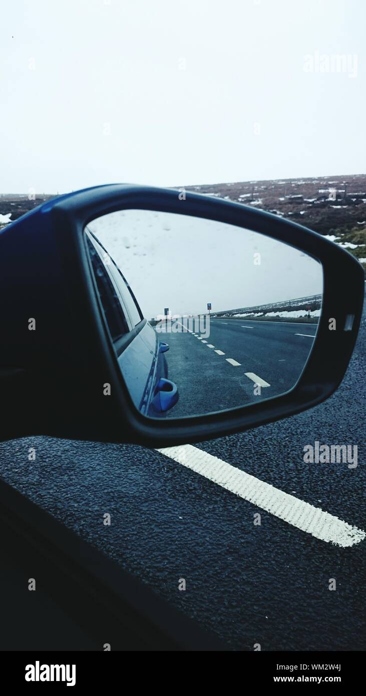 Reflection Of Street In Rear View Mirror Stock Photo Alamy