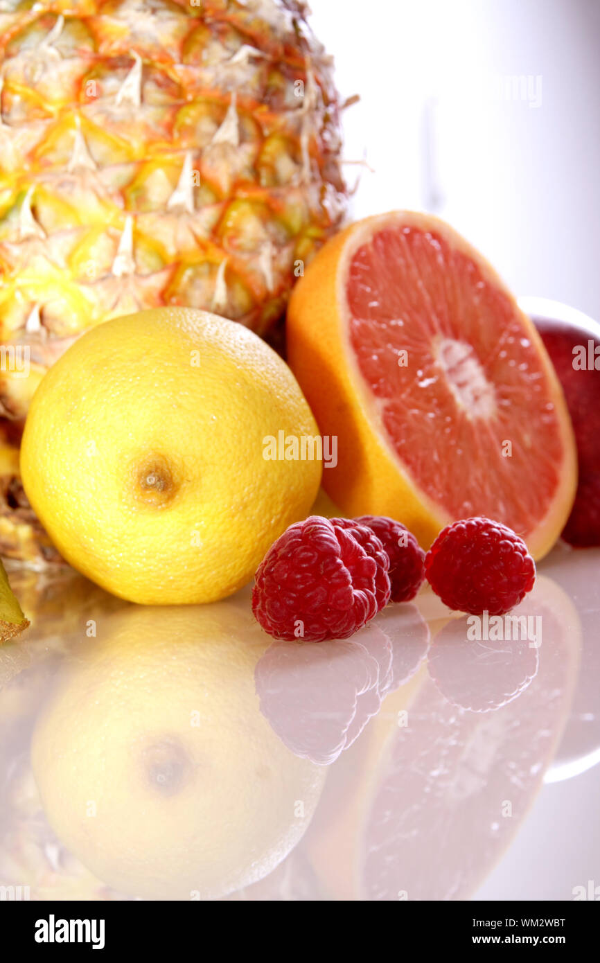 Close-up Of Fruits With Reflection Over White Background Stock Photo