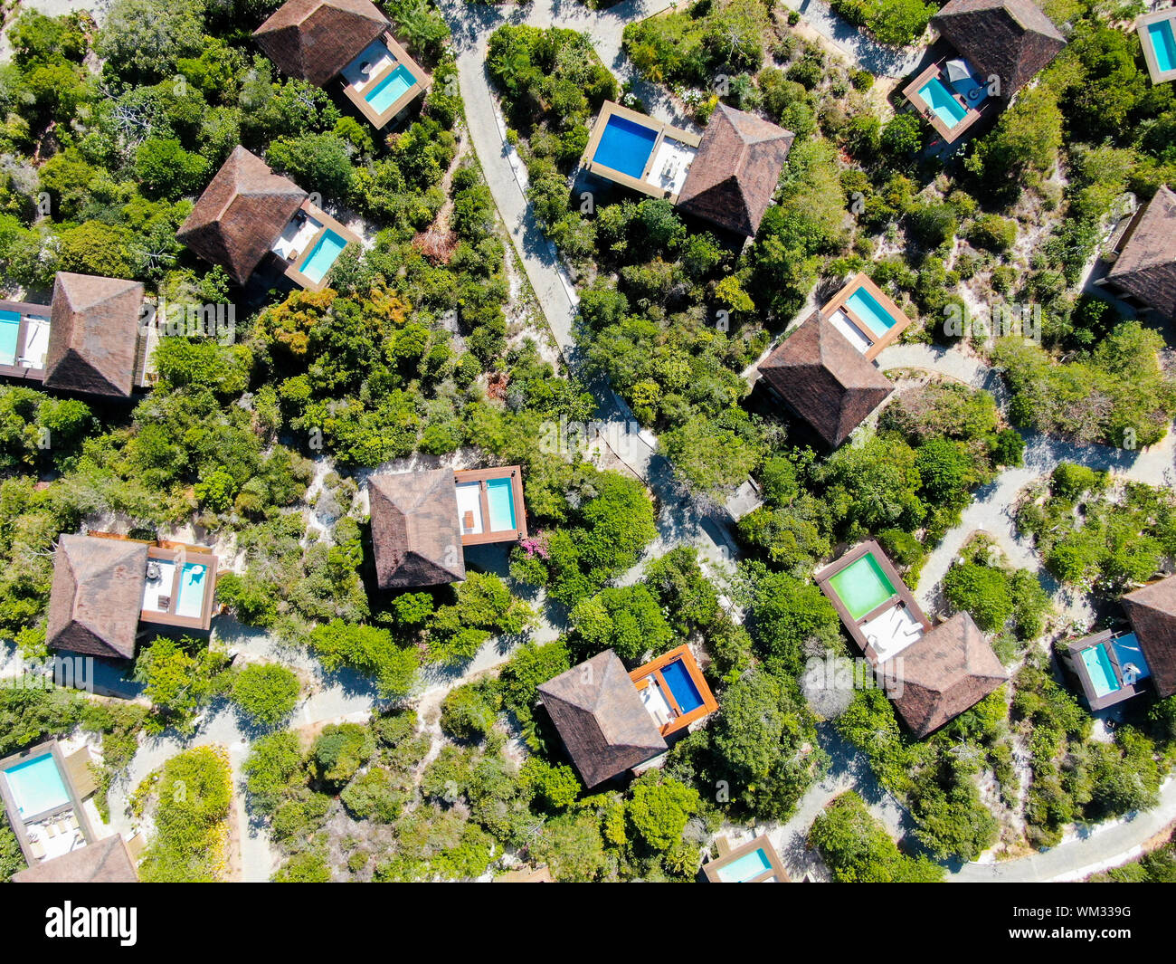 Aerial view of luxury villa with swimming pool in tropical forest ...