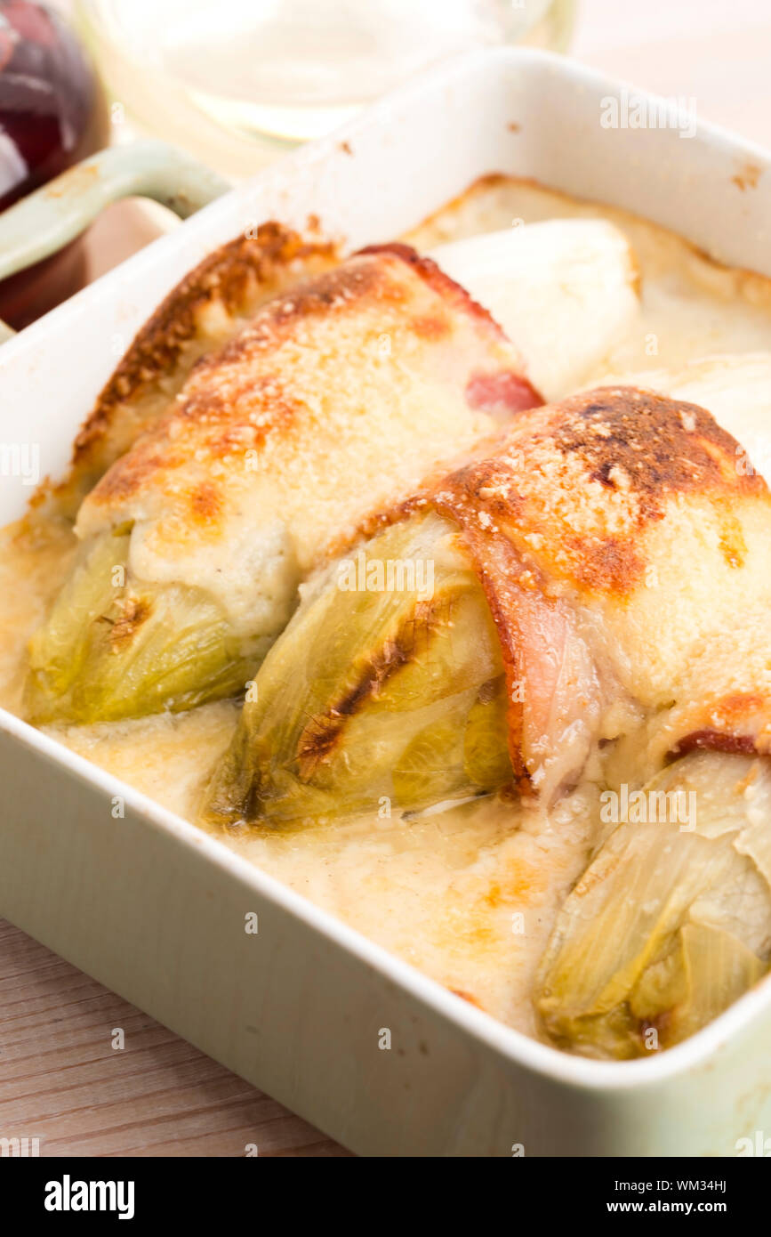 chicory baked with bacon and cheese Stock Photo