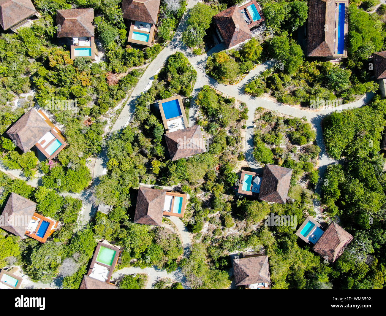 Aerial view of luxury villa with swimming pool in tropical forest ...