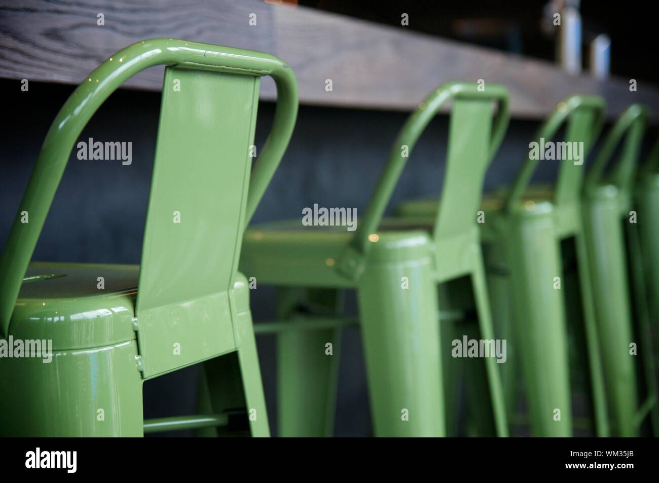 Green Barstools Arranged By Counter Stock Photo Alamy