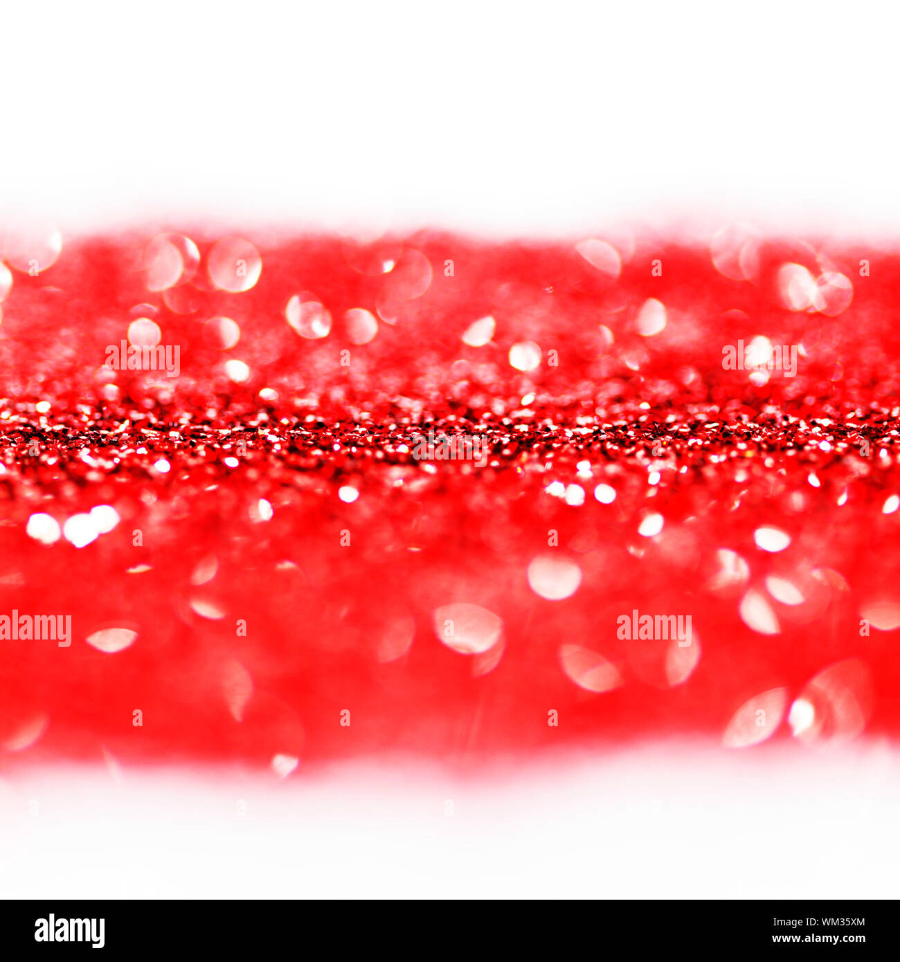 Red twinkling lights abstract holiday background with white copy space Stock Photo