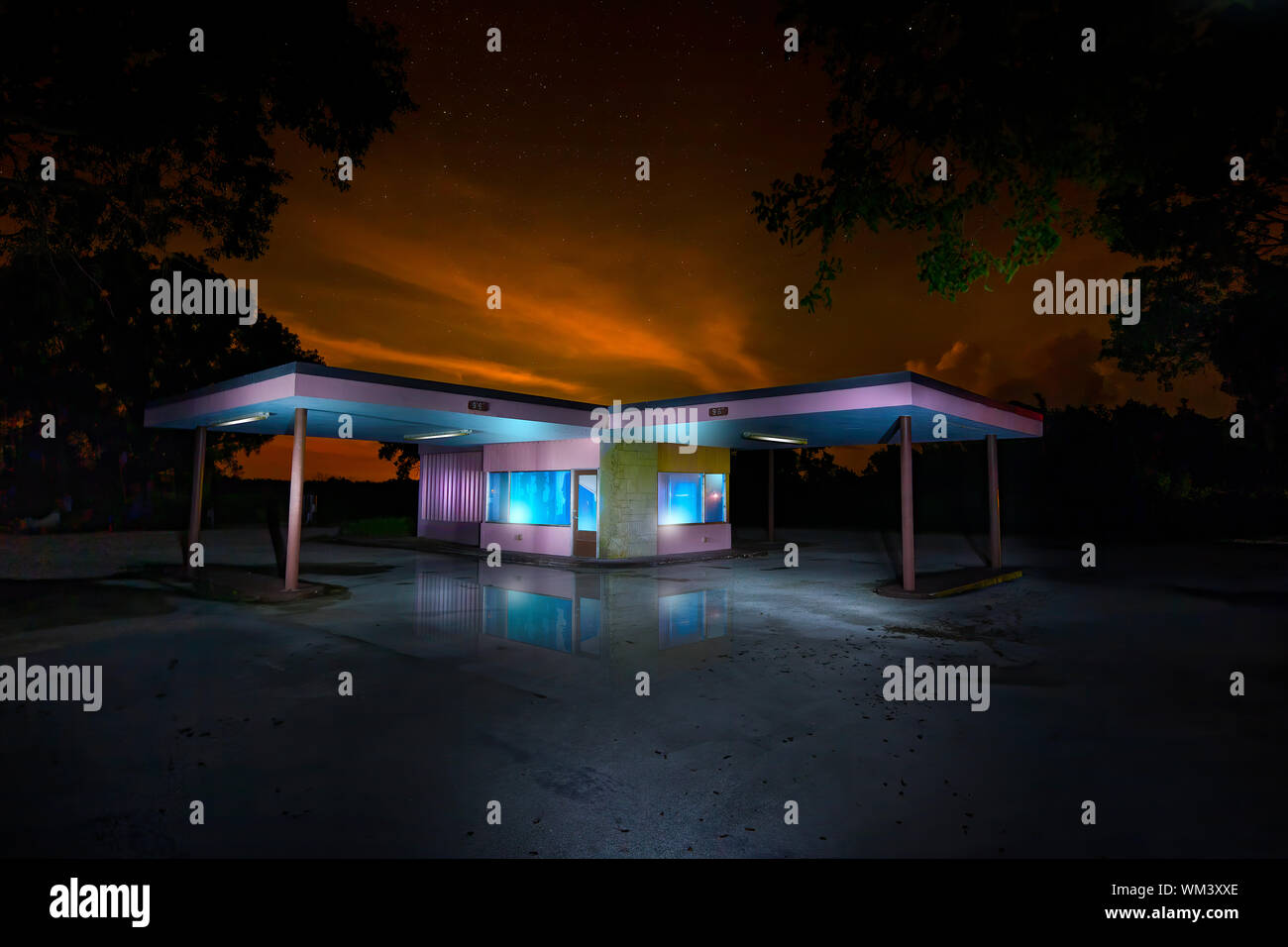 An abandoned gas station and visitor center in Everglades National Park. The look of this image was achieved by light painting several exposures. Stock Photo
