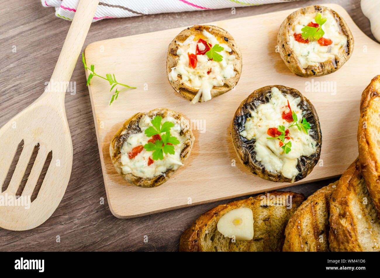 Grilled mushrooms stuffed with blue cheese and chilli and garlic toast