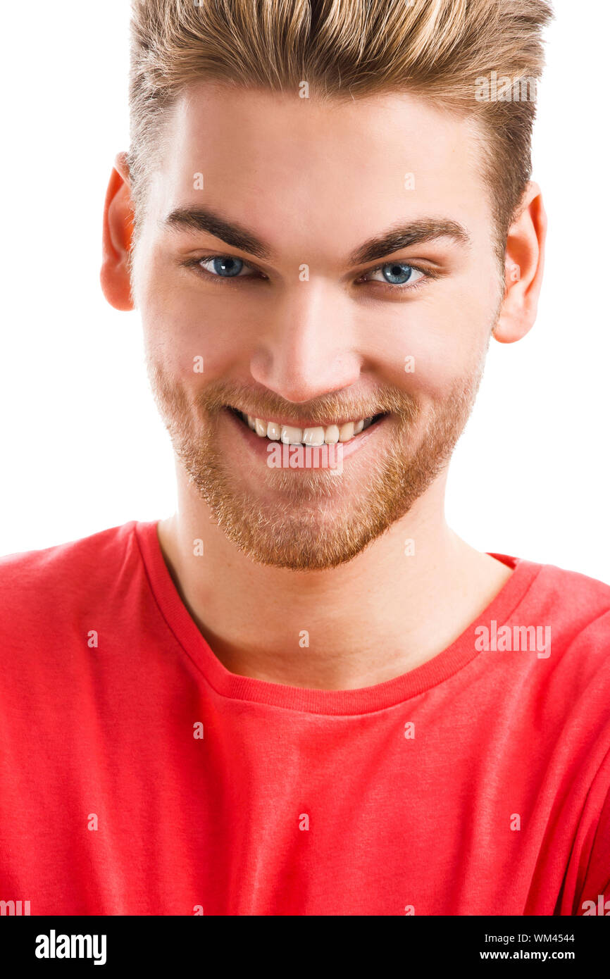 Handsome young man smiling and looking to the camera, isolated on white ...