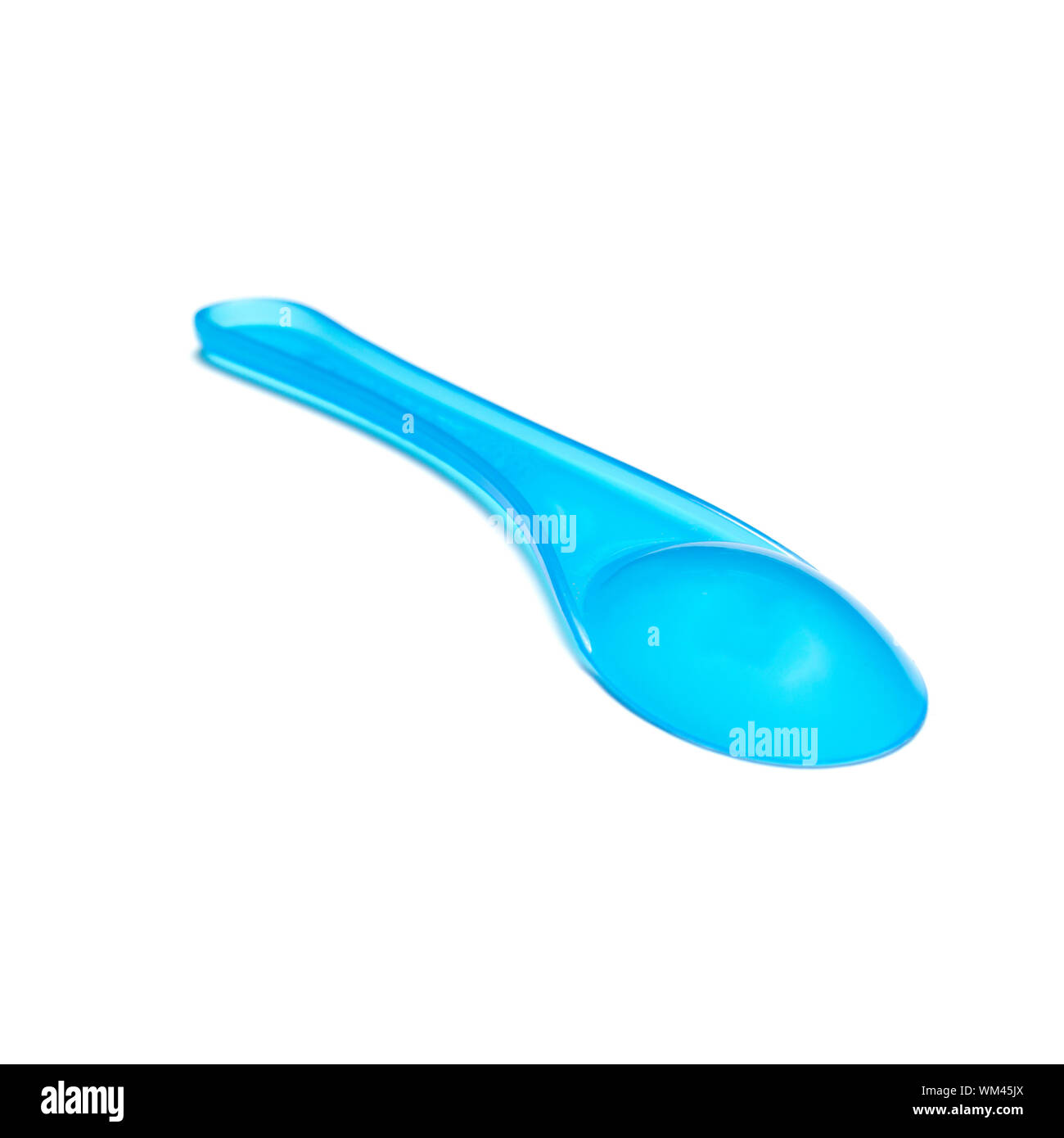 blue plastic spoon on a white background Stock Photo - Alamy