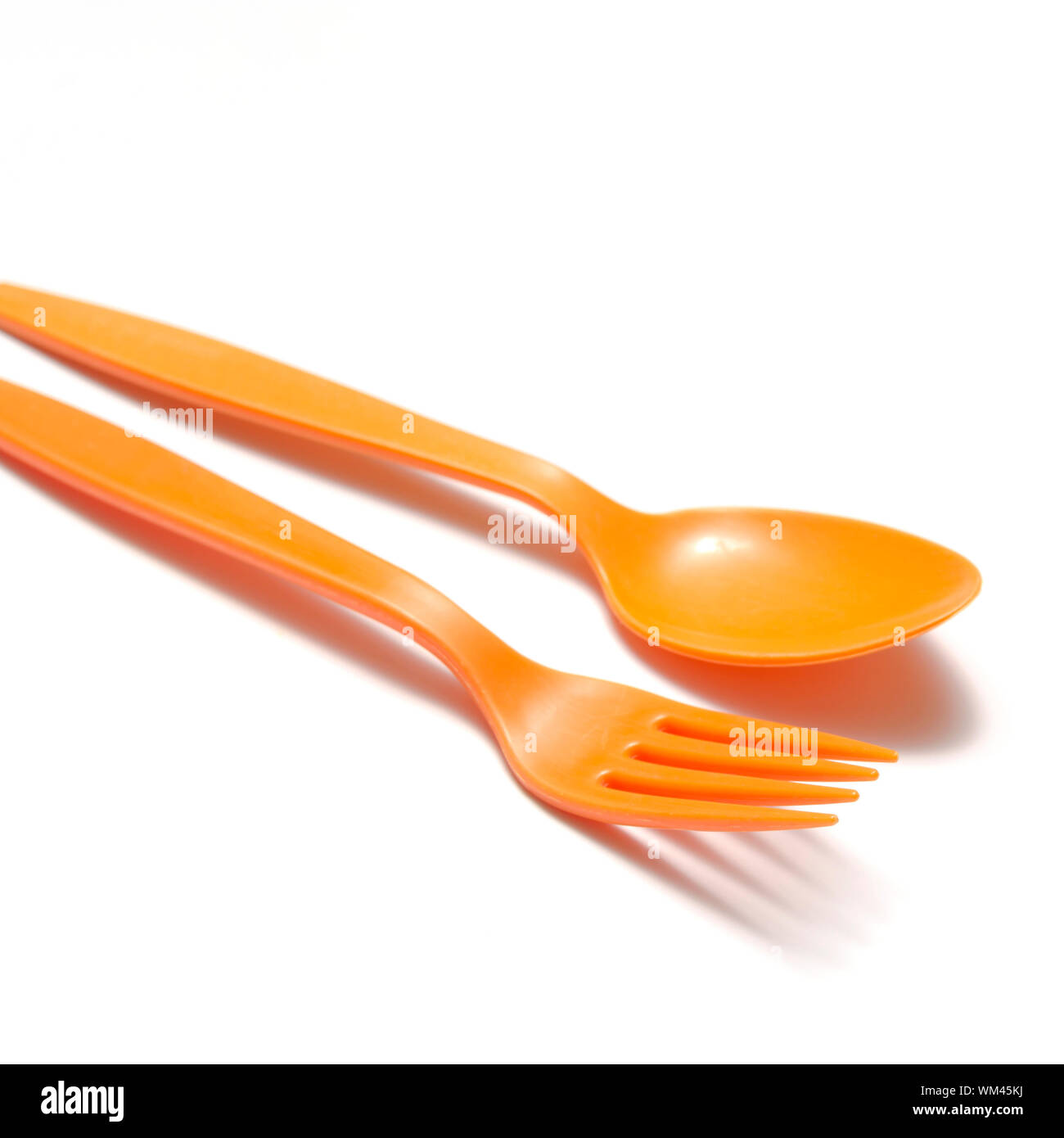orange plastic spoon and fork Stock Photo Alamy