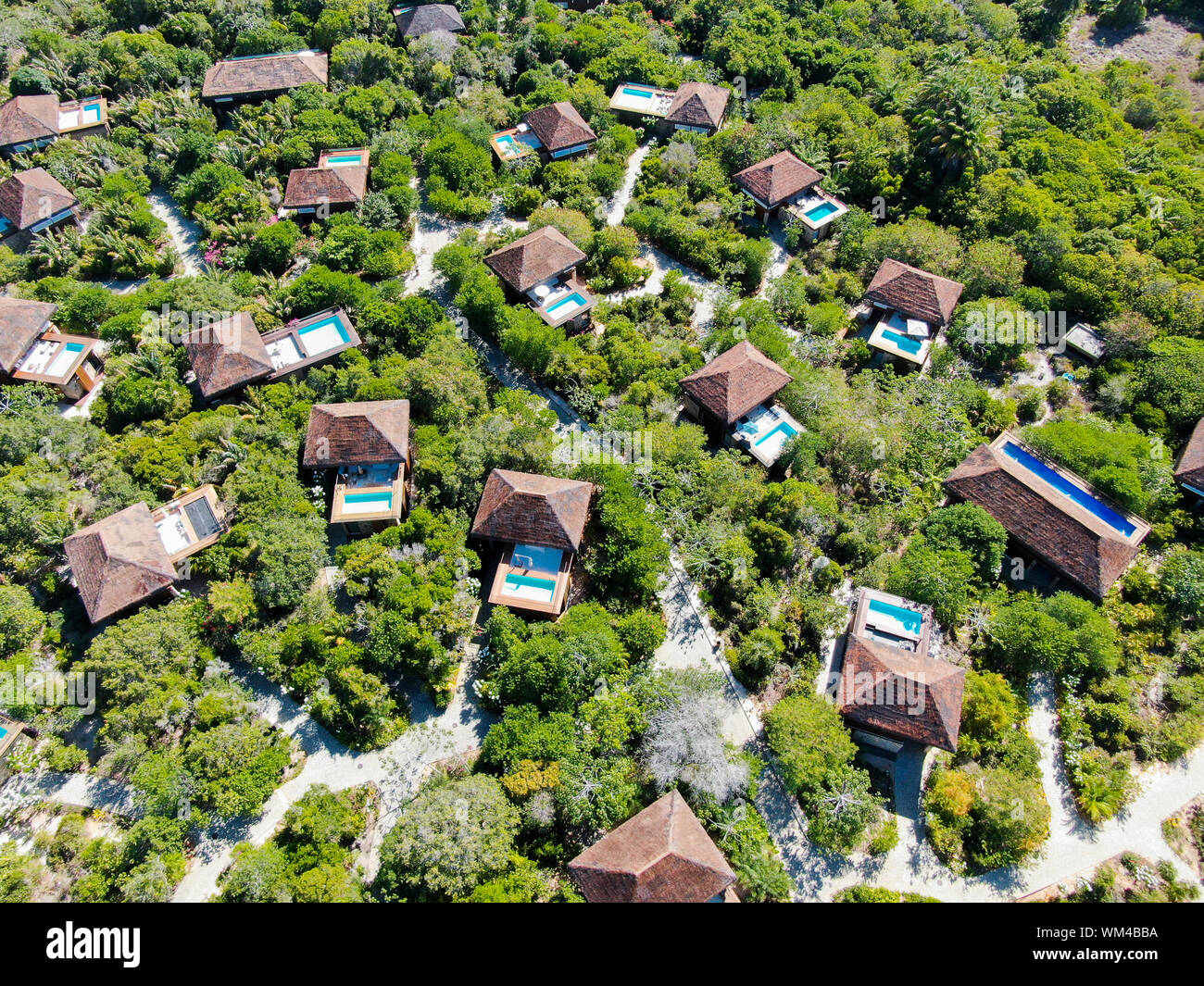 Aerial view of luxury villa with swimming pool in tropical forest ...