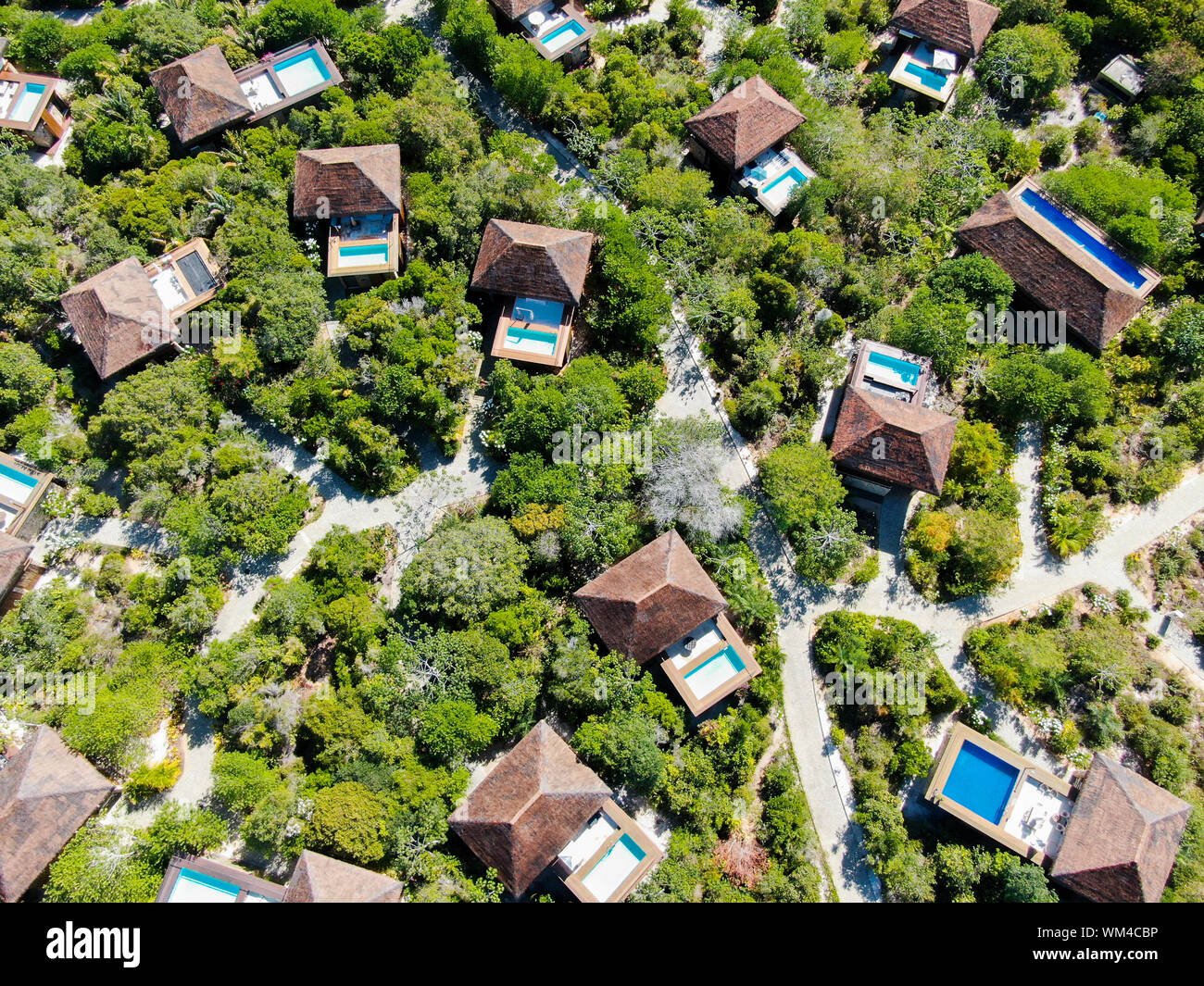 Aerial view of luxury villa with swimming pool in tropical forest ...