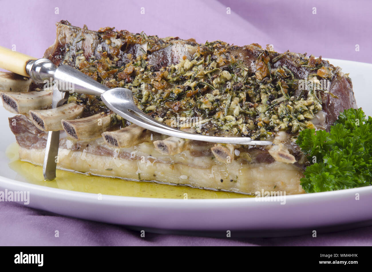 roasted french style lamb rack with herb crust Stock Photo - Alamy