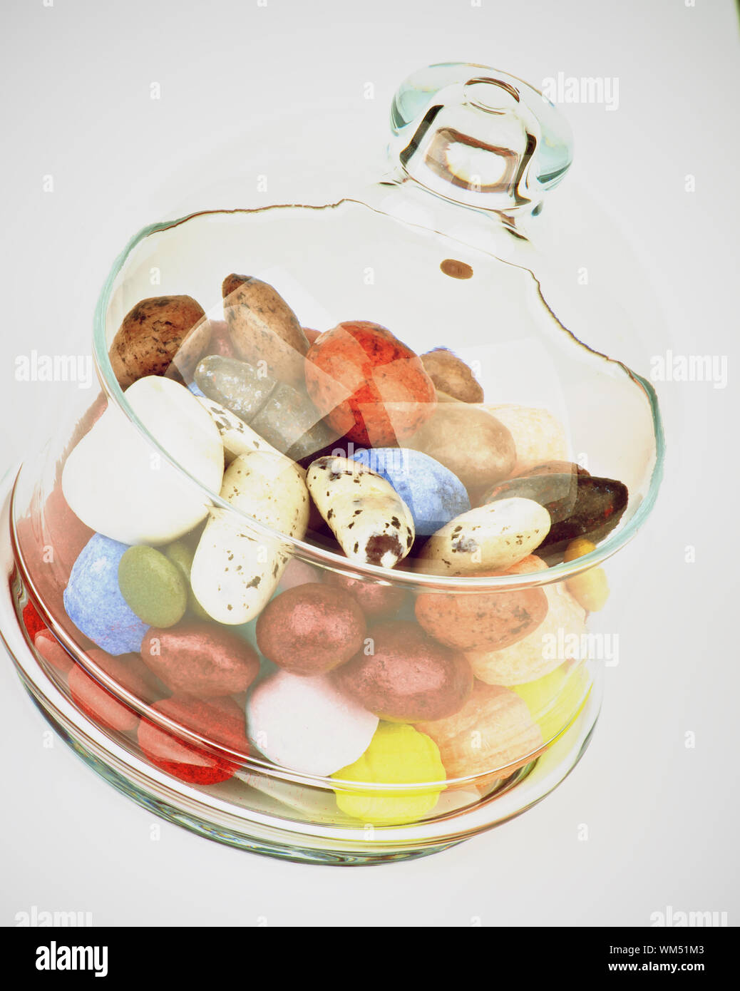 Various Colored Gum and Hard Candies in Glass Jar with Lid closeup