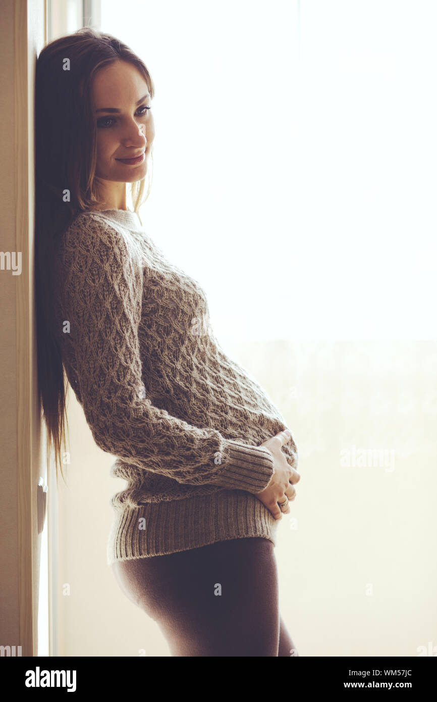 Home portrait of pregnant woman Stock Photo