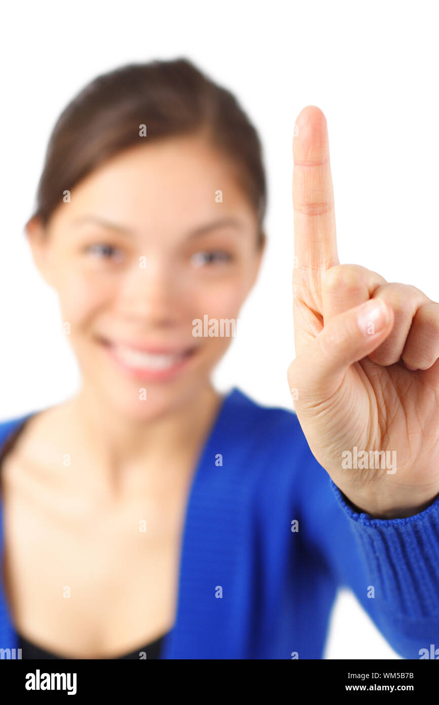 Young asian female student asking a question or pointing up with one ...