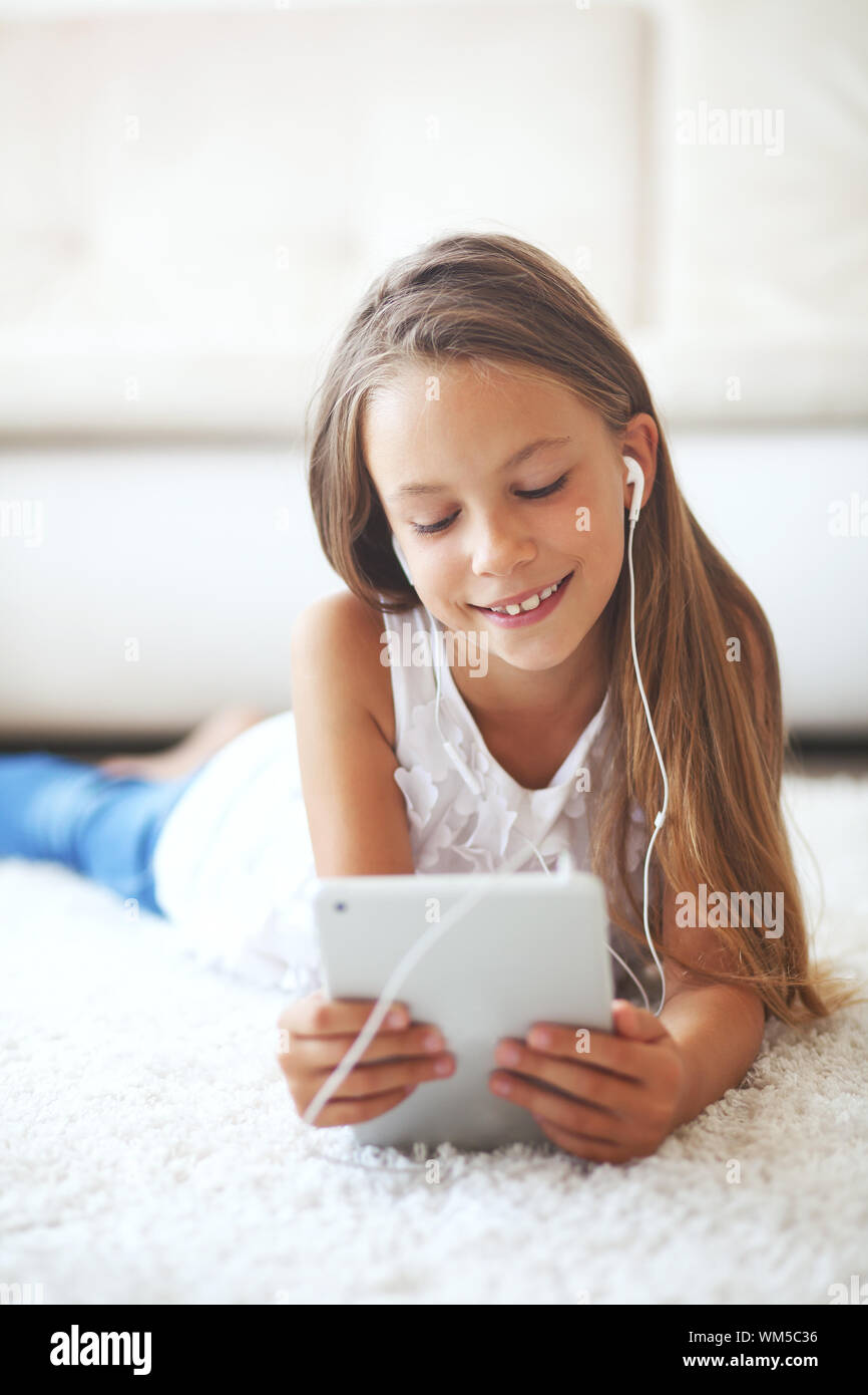 Pre teen girl with tablet pc Stock Photo