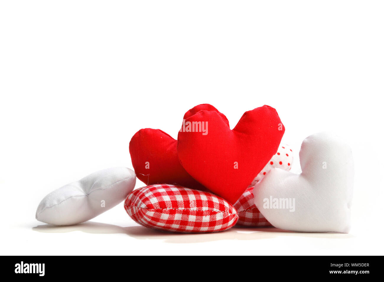 Textile red hearts isolated on white background Stock Photo - Alamy