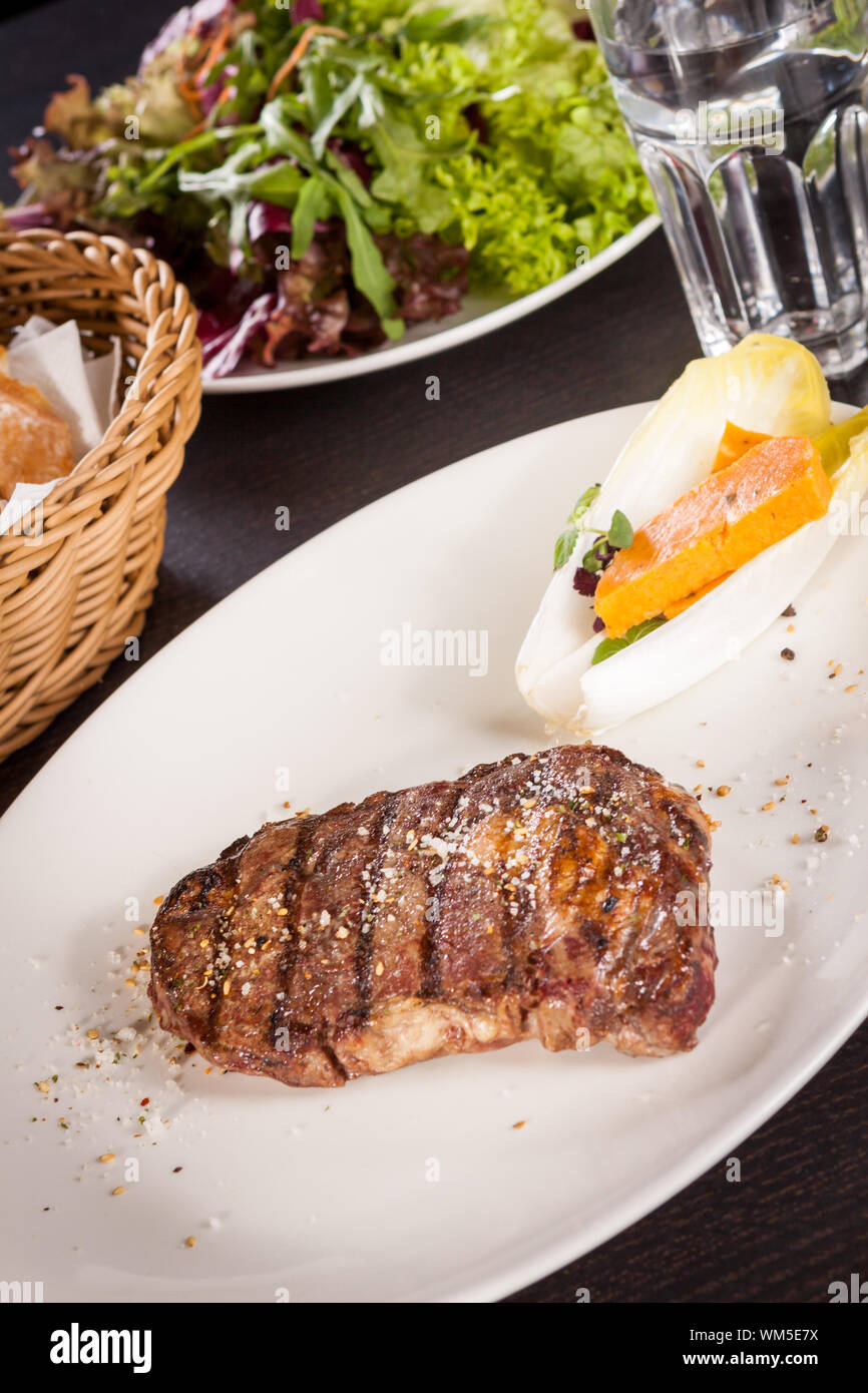 Grilled beef steak with seasoning Stock Photo Alamy