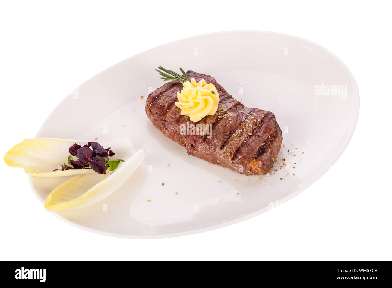 Grilled beef steak topped with butter and rosemary Stock Photo