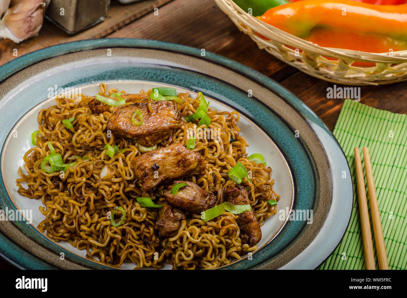 Chinese noodles with chicken and onion, peppers and soy Stock Photo Alamy