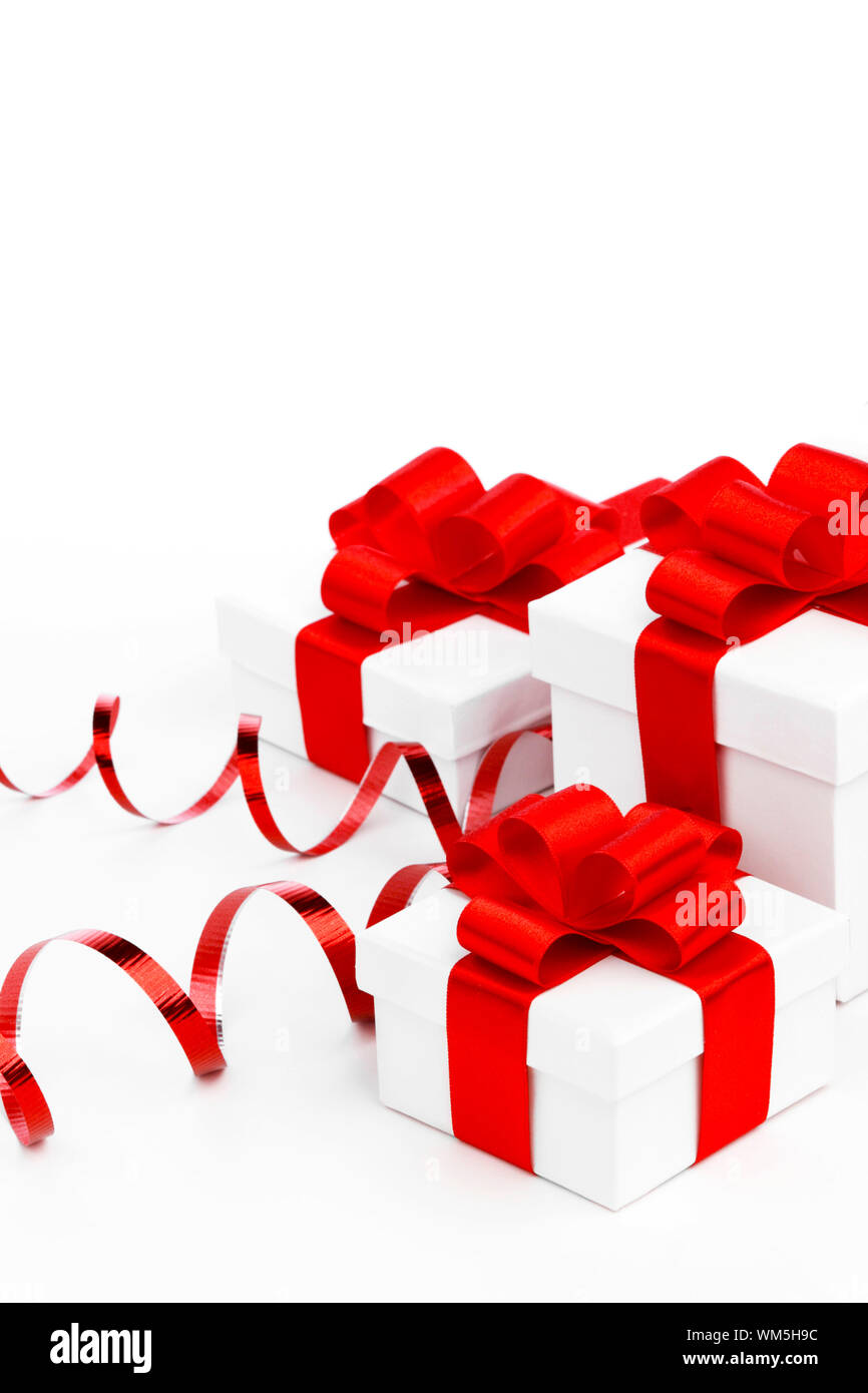White gift boxes with red ribbons isolated on white background Stock ...