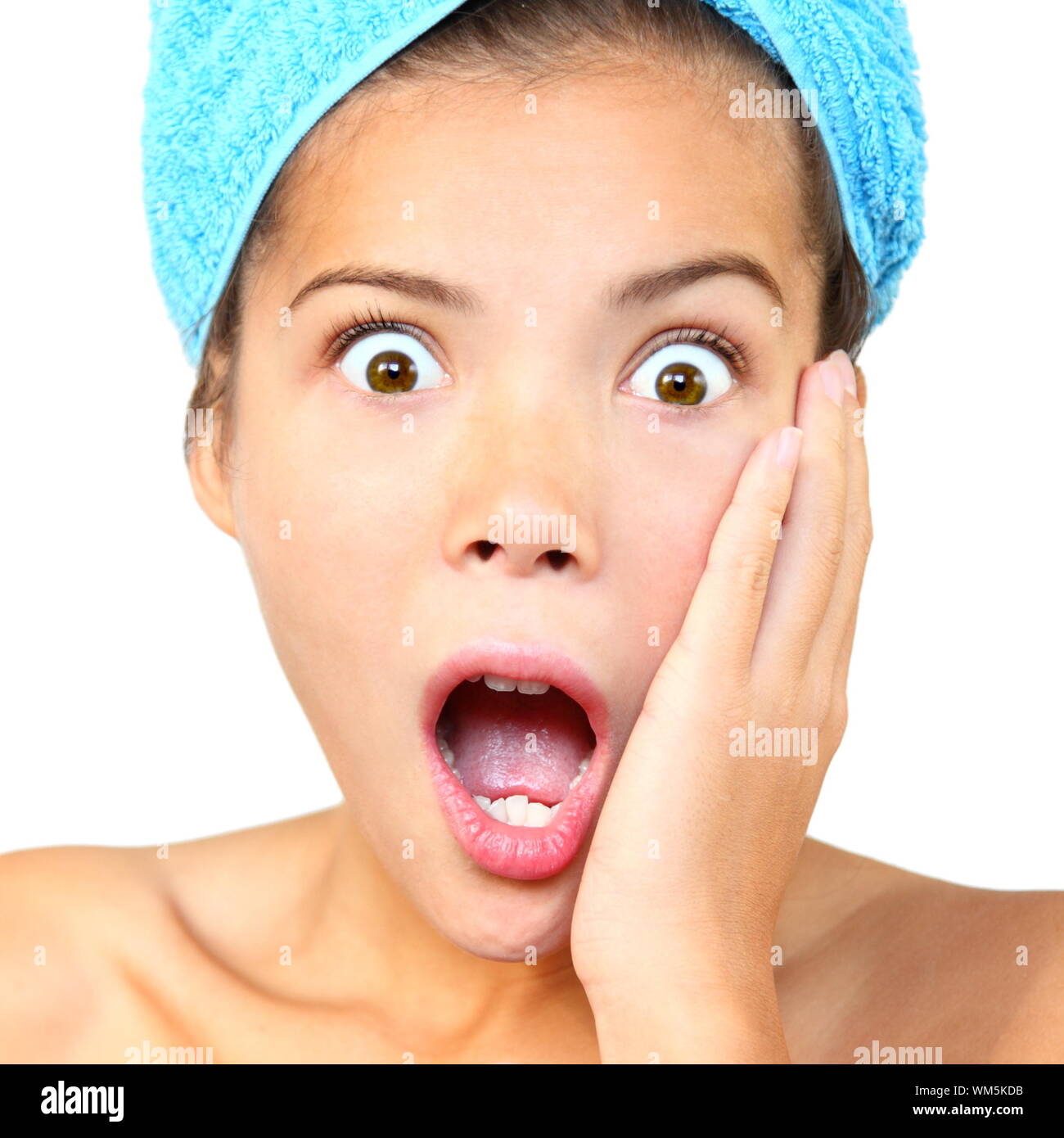 Surprised out of shower woman shocked. Closeup of Beautiful young woman