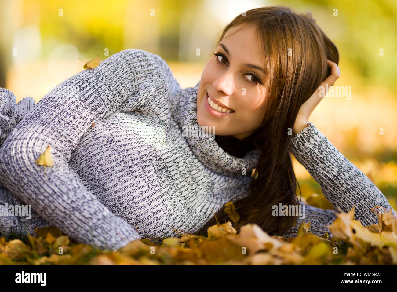 Happy smiling young woman portrait autumn outdoors Stock Photo - Alamy