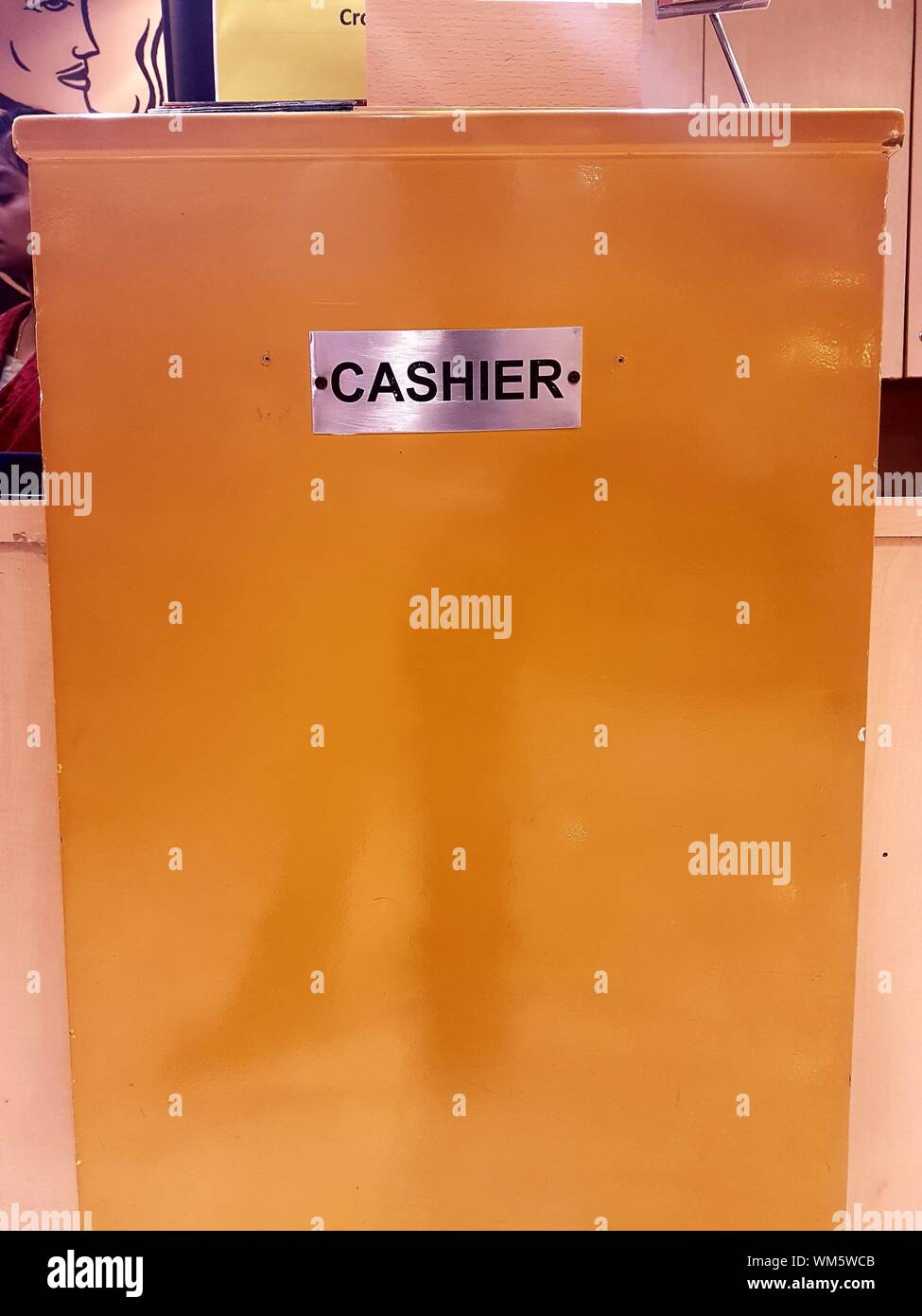 Cashier Sign On Metal Container Stock Photo