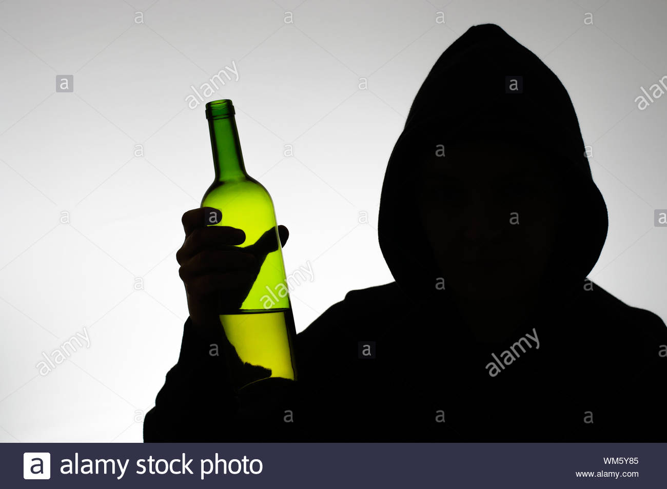 Silhouette Of Hooded Anonymous Alcoholic With A Wine Bottle Stock Photo Alamy Silhouette Of Hooded Anonymous Alcoholic With A Wine Bottle Stock Photo Alamy