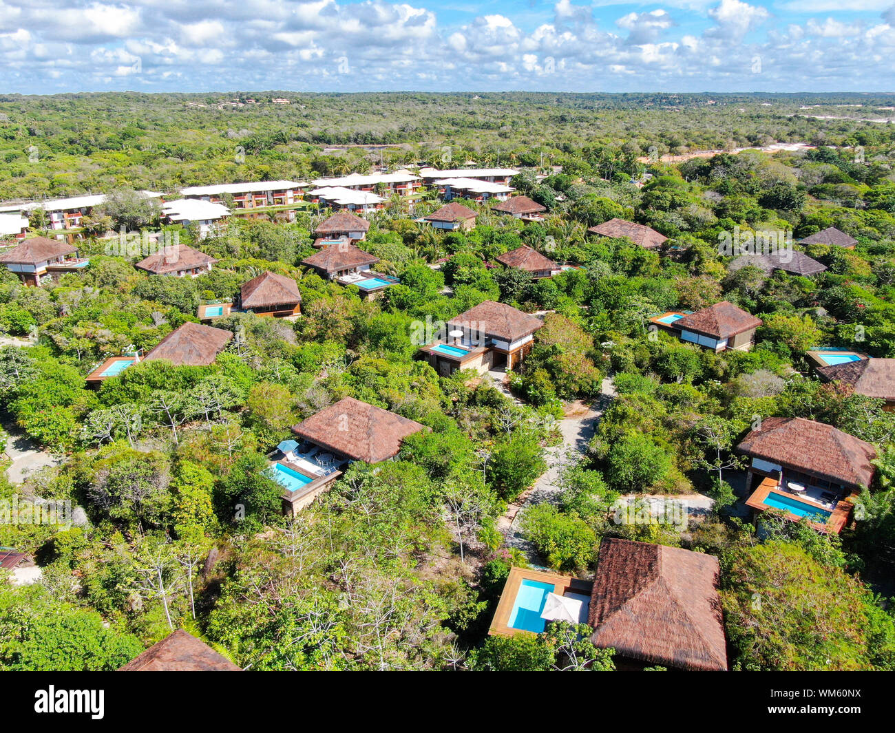 Aerial view of luxury villa with swimming pool in tropical forest ...