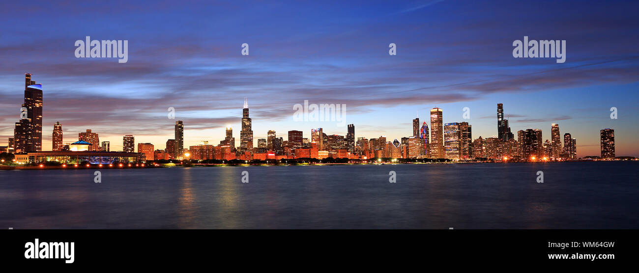 Panoramic view of Chicago skyline at dusk with Lake Michigan on the foreground, IL, USA Stock Photo